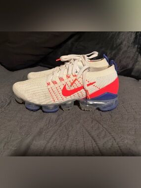 Nike Kids White Knit Sneakers with Bright Red and Blue Accents